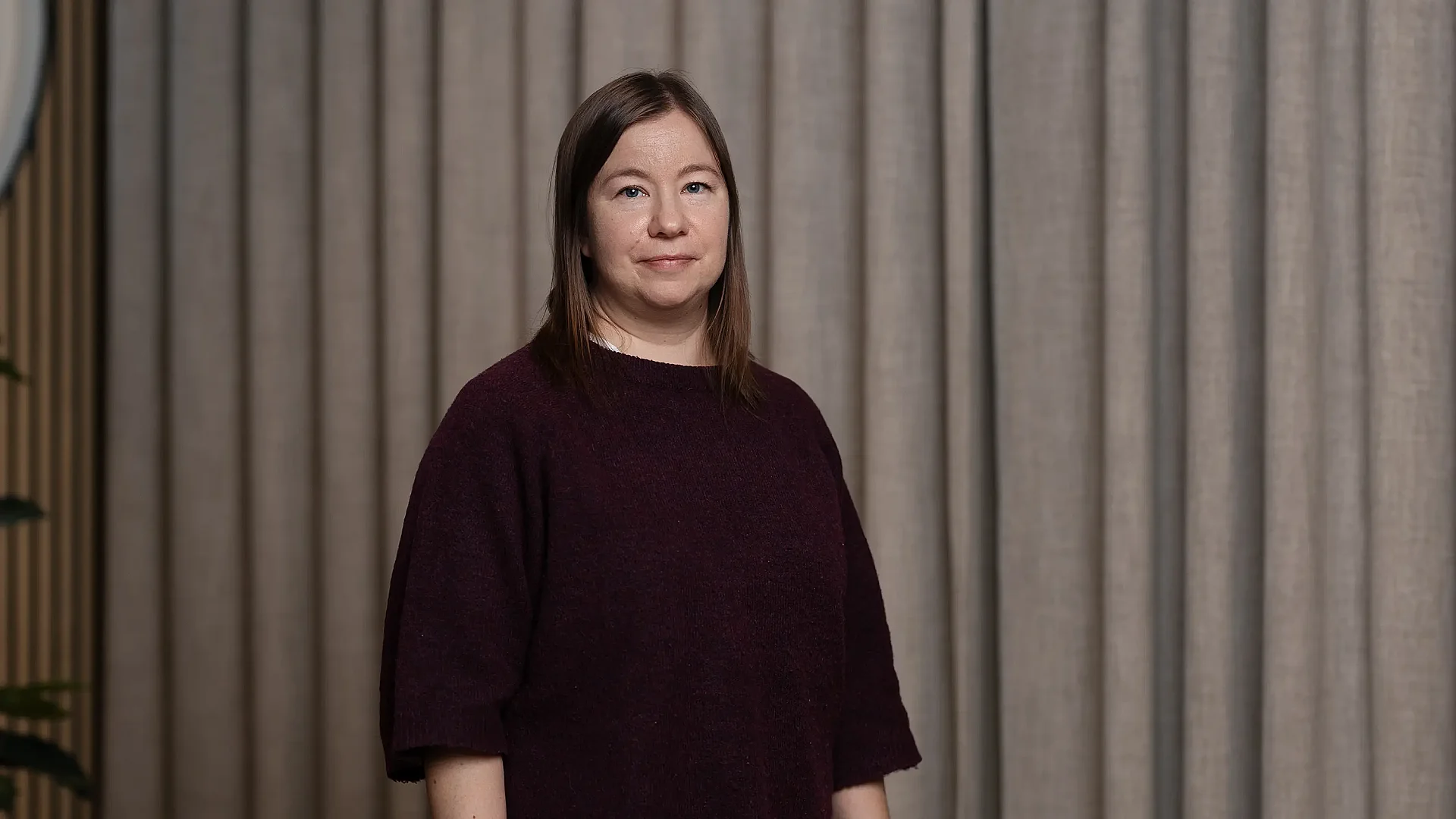 Woman posing for portrait in dark sweather